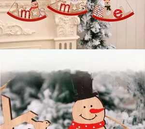 Detail view of Xmas and Noel wooden ornaments with snowman and reindeer decorations