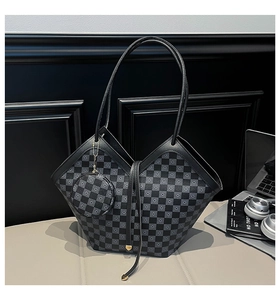 Detail of checkered bucket bag featuring geometric folding structure and mini coin purse