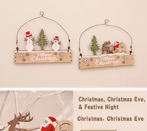 Detail of wooden Merry Christmas sign featuring snowman and reindeer holiday patterns
