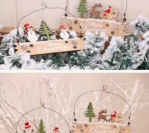 Detail of wooden Merry Christmas hanging ornaments with snowman and reindeer shapes