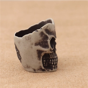 Detail of vintage skull shaped LED light container with realistic aged stone texture