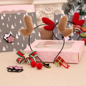Christmas hair accessory gift set featuring reindeer headbands and festive bow clips