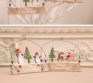 Detail of wooden Merry Christmas sign with snowman, reindeer and santa claus figures