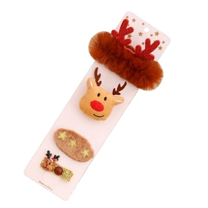Christmas hair accessory set with red reindeer antlers, plush clips, and star decorations