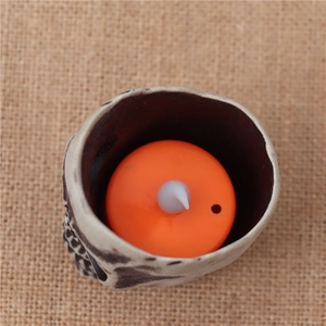 Halloween decorative LED electronic candle light with realistic resin skull container base