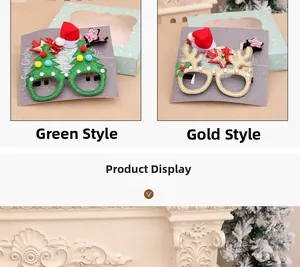 Detail of Christmas tree and reindeer antler glasses with sparkling festive decorations