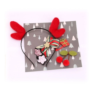 5-piece Christmas hair accessories set with reindeer antlers and festive bows on card
