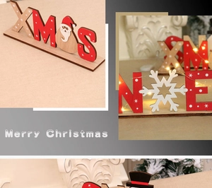 Dettaglio di decorazione natalizia in legno fai-da-te con Babbo Natale e neve