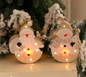 Close-up of lighted wooden Christmas ornaments with LED stars and reindeer carving