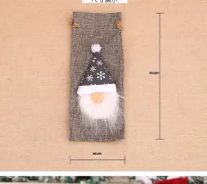 Detail view of a Christmas gnome wine bag with snowflake pattern and size dimensions