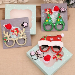 Christmas gift set with reindeer antlers, tree glasses, hair clips and festive accessories