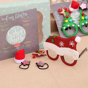 6-piece Christmas gift set featuring glitter glasses, themed hair clips and star hair ties