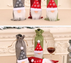 Three-piece gnome wine bottle covers with felt snowflake hats and plush white beards