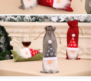 Detailed view of Christmas wine bottle covers with gnome hats and snowflakes in a festive setting