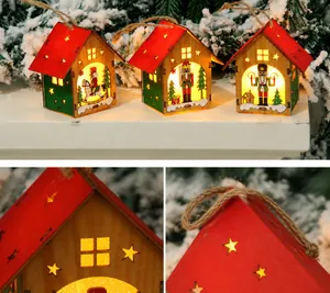 Three glowing DIY wooden Christmas houses with nutcracker soldiers and warm LED lights