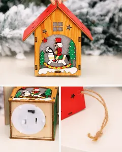 Close-up of the LED base switch and rustic jute rope on a DIY wooden Christmas house