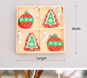 Detail of Christmas wooden ornaments in four-grid storage box with red and green charms