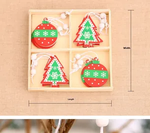 Detail of Christmas wooden ornaments in four-grid storage box with red and green charms