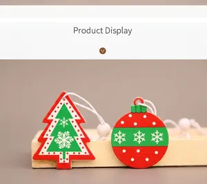 Detail of red and green wooden Christmas tree and ball ornaments with snowflake patterns