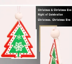 Detail view of a red snowflake pattern wooden Christmas tree ornament with a hanging bead