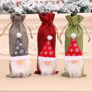 Christmas gnome wine bottle covers in red, grey and green for festive table decoration