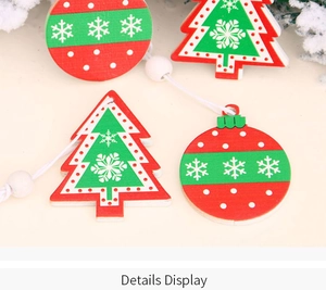 Close-up of wooden Christmas ornaments with painted snowflakes and festive red and green dots