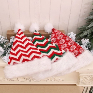 Three premium knitted Christmas hats with red and green stripe patterns and plush pom poms
