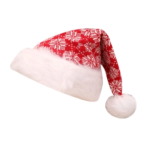 Knitted red Christmas hat with white snowflake patterns and plush pom-pom decoration