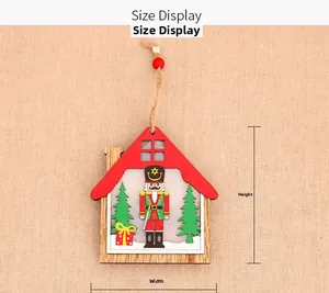 Detailed size view of wooden Christmas house pendant with nutcracker and red roof