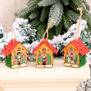 Luminous wooden Christmas house pendants with nutcracker scenes and festive tree decor