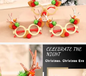 Detail view of festive Christmas glasses with red reindeer antlers and sparkly sequins