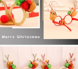 Close-up of festive Christmas reindeer glasses with glitter frames and plush pom-poms