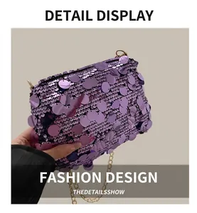 Close-up of purple sequins and gold metal chain on a large fashion crossbody square bag