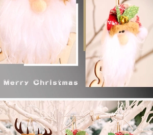 Detail of plush Santa Claus and reindeer Christmas ornaments hanging on white branches
