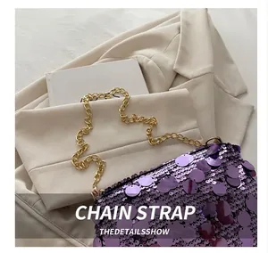 Detailed view of the purple sequin handbag with a premium golden metal chain strap