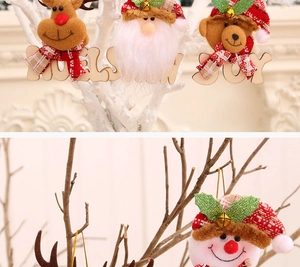 Detail of wooden Christmas dolls with bells and Noel Snow Joy engraved letters
