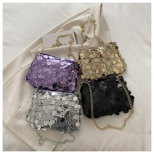 Detail of sequin flap bags in purple gold silver and black with metallic chains