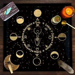 Black velvet tarot tablecloth with golden Wheel of the Year design and moon phases