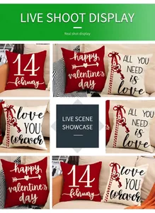 Linen Valentine's Day pillow covers with red heart prints on a sofa in a cozy home setting