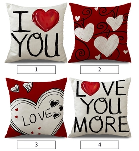 Detail of four linen heart-shaped pillow covers with Love and I Love You More prints
