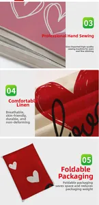 Detail of durable linen pillowcase with red heart pattern and manual stitching