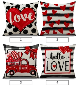 Detail view of four linen Valentine's pillow covers with heart and letter prints