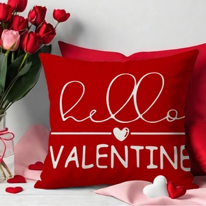 Red Valentine pillow cover with white heart and hello VALENTINE text in romantic setting