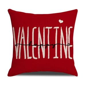 Close-up of red linen Valentine pillow cover with happy valentine art text and heart