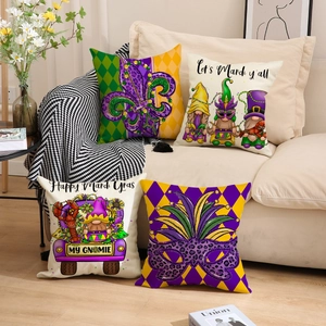 Set of four Mardi Gras pillow covers with fleur-de-lis and gnomes on a cozy sofa
