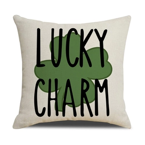 Detail of linen texture pillowcase with green clover and Lucky Charm print