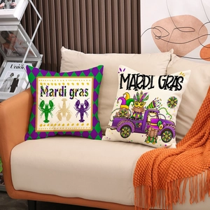 Set of two Mardi Gras themed throw pillows with lobster and truck prints on a beige sofa
