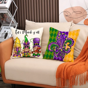 Set of two Mardi Gras throw pillows featuring gnomes and fleur-de-lis on a cozy sofa