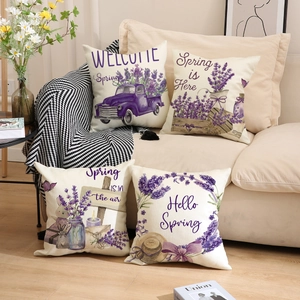 Set of 4 lavender print linen pillow covers on a beige sofa for spring home decor