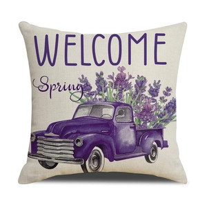 Detail of linen pillow cover with lavender truck print and Welcome Spring text